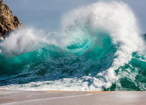 July - A crashing wave hitting the shore